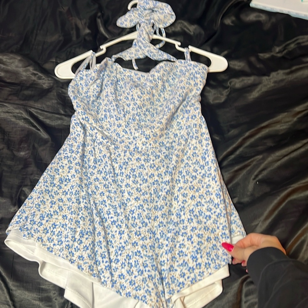 White and blue floral romper. A beautiful tie aswell as an open back